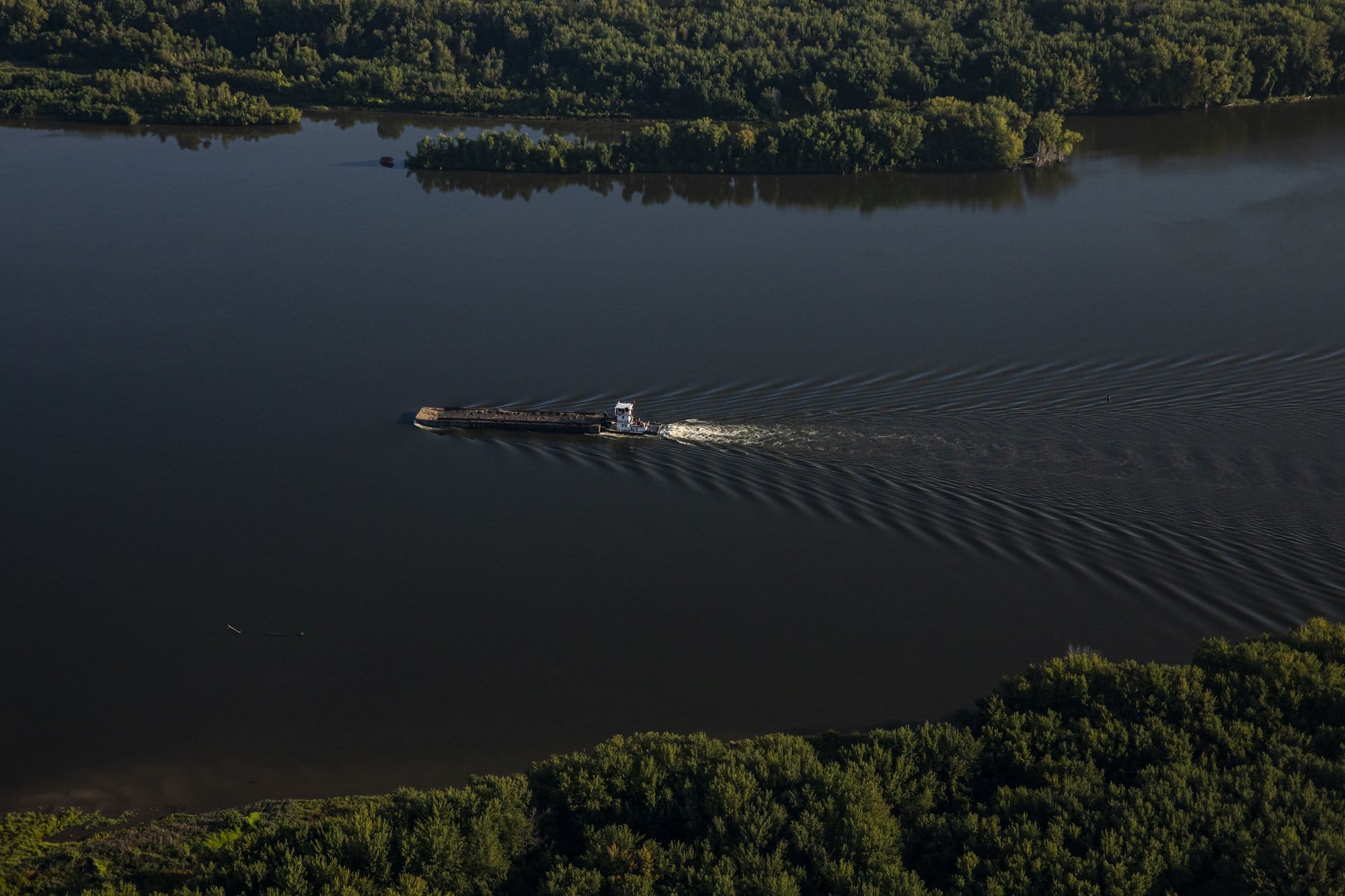 A barge travels down the Mississippi River near the Quad Cities on Sept.