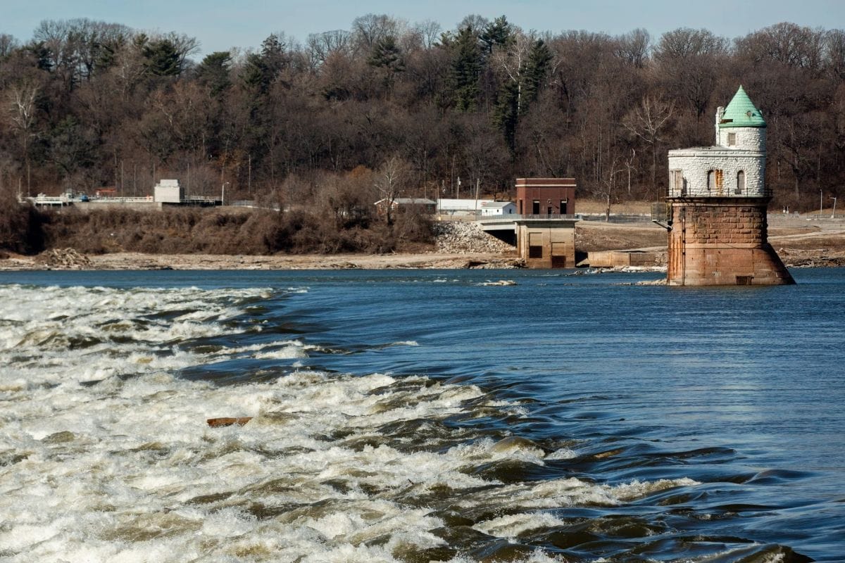 The river tumbles over rocks on a winter day