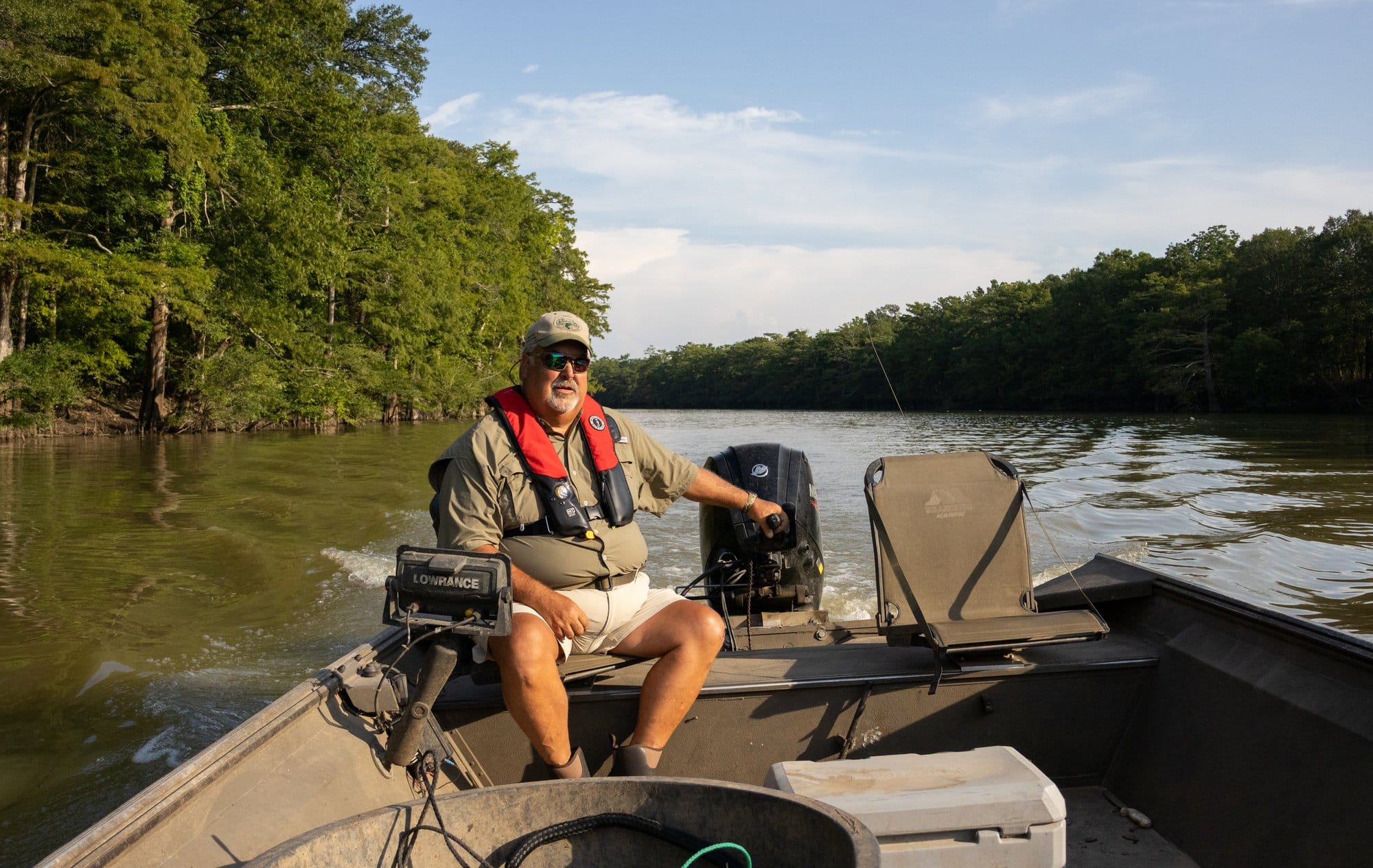 Jimmy Barnett, an invasive carp biologist with the Arkansas Game and Fish Commission, pilots a boat on the Cache River.