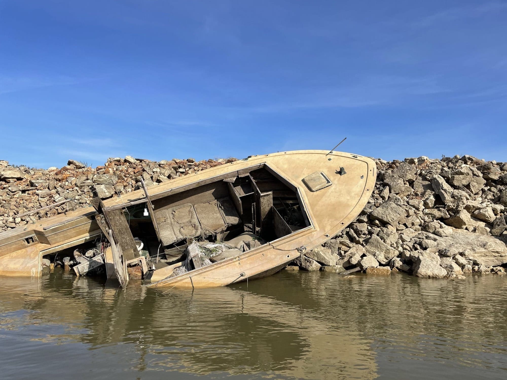 A sunken boat is exposed by low river levels at Cape Girardeau, Mo.