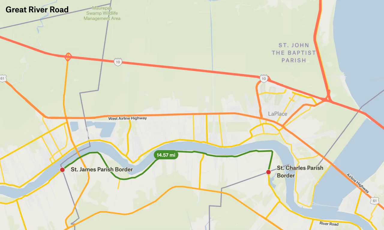 Map showing the proposed district spanning 11 miles from parish to parish, with a 14.57-mile driving route that curves along the Mississippi River.