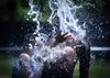 Children play in water at a splash pad