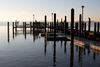 The sun rises over a dock on Chesapeake Bay 