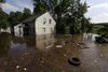 Mississippi River floodwaters surround a house in Memphis