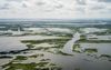 Aerial view of sparse land intermixed with streams and water bodies