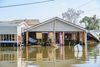 A house in the Plaquemines Parish community of Ironton, along the west bank of the Mississippi River south of New Orleans, is flooded heavily during Hurricane Ida in 2021. 