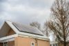 Solar panels on top of a small roof