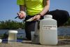 City of Cedar Rapids water quality analyst Candice Kucera records notes after testing a water sample at Winnebago Park in Cedar Rapids, Iowa.