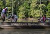A group of Arkansas Game & Fish Commission invasive carp specialists in a boat patrol the Cache River in eastern Arkansas. 