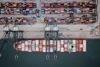 A ship is docked at a barge