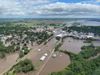 Aerial view of flooding in northwest Iowa, with streets and homes submerged in water.