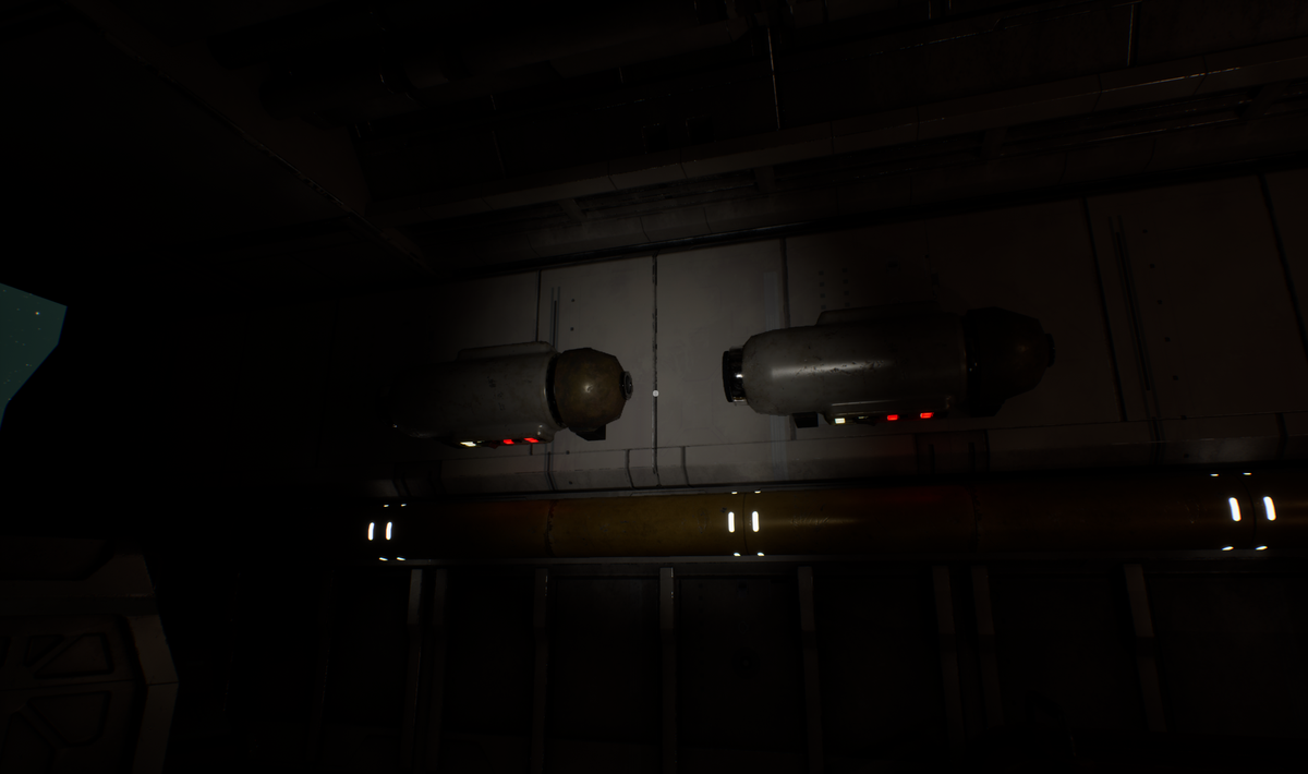 An image of the ship cabin with all the lights off, but with a flashlight shining on the wall, illuminating a small circle in the middle. Small enough to make you wish for more.