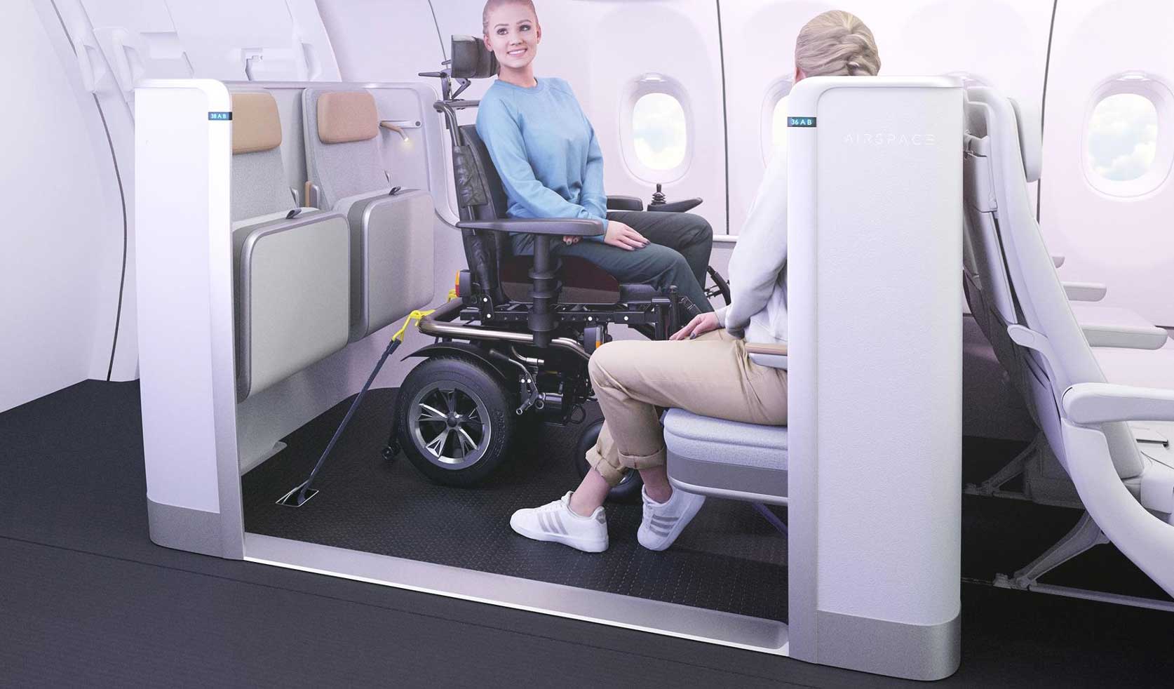 Wheelchair securement seating area in airplane, with two rows of seats facing each other, fold down seating surfaces and a wheelchair secured to the floor using straps and hooks.