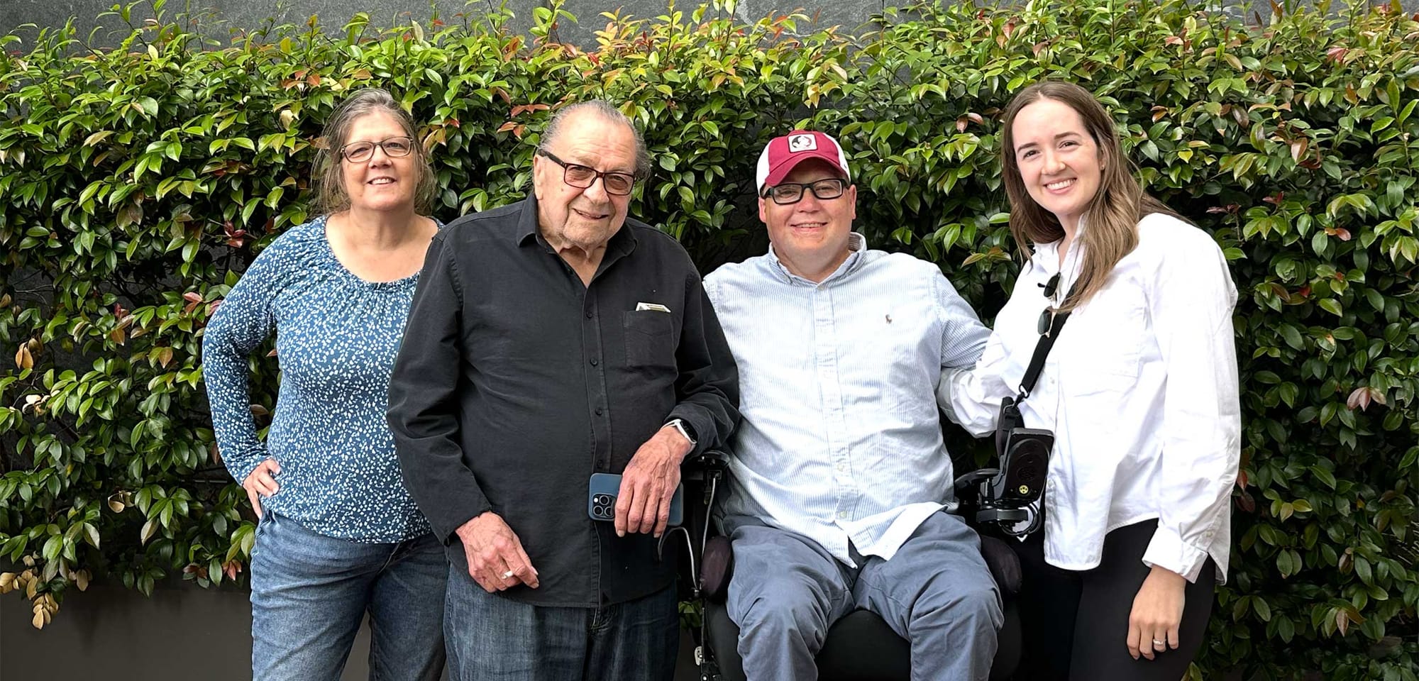 John pictured with him mom, grandpa and sister.