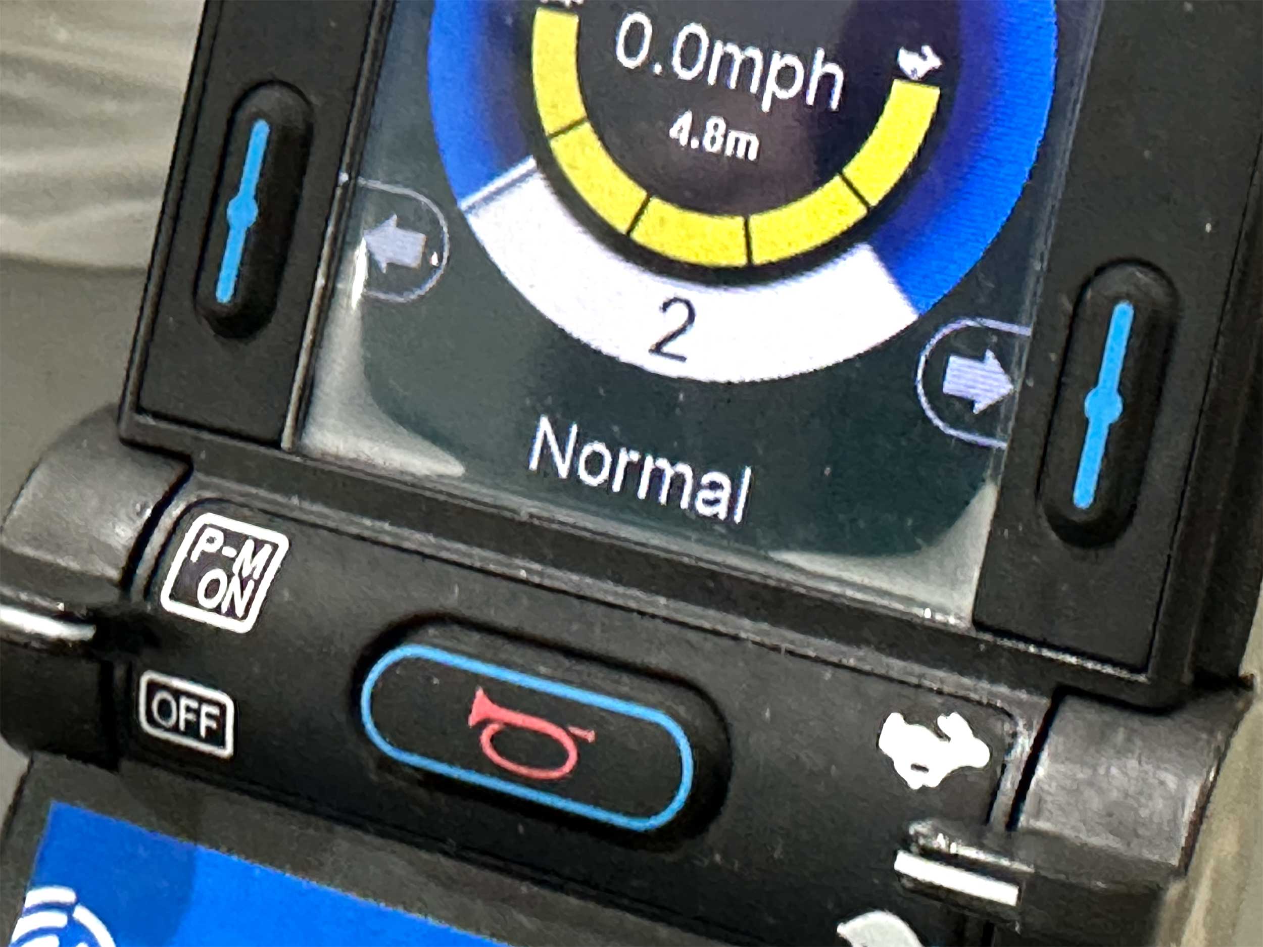 Water pooling on the edges of a power wheelchair joystick.