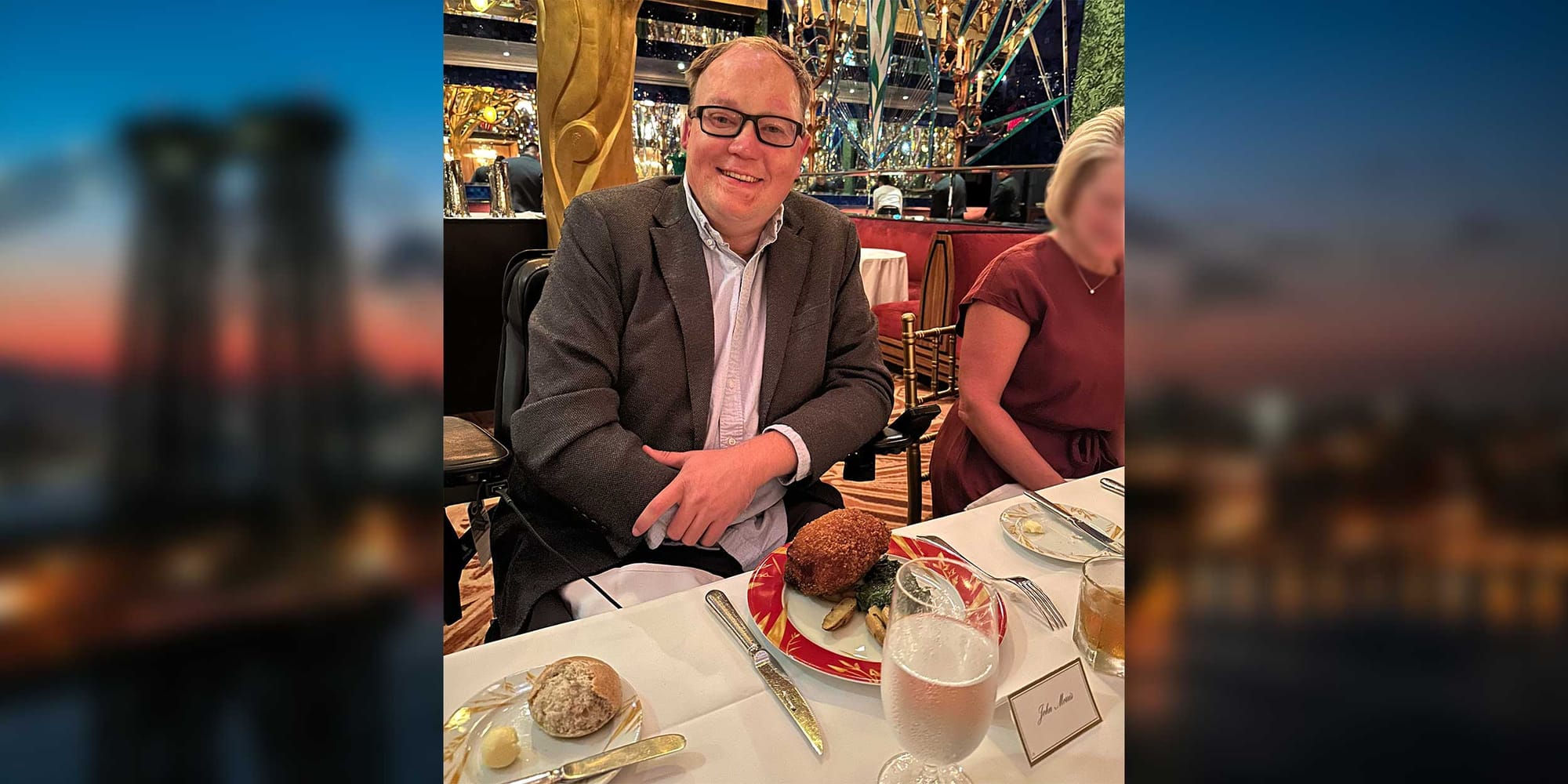 John seated at a table inside the Russian Tea Room in New York City.
