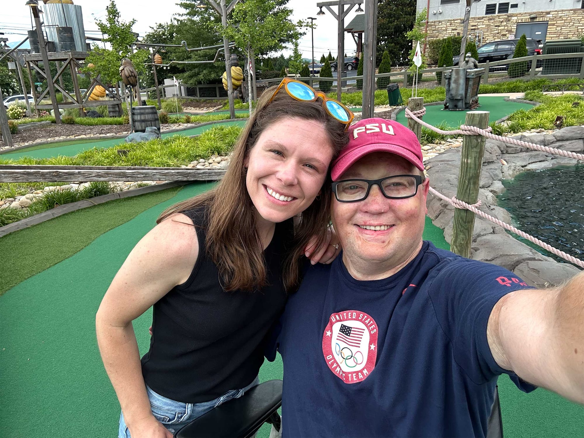 Selfie of John and Robert on mini golf course.