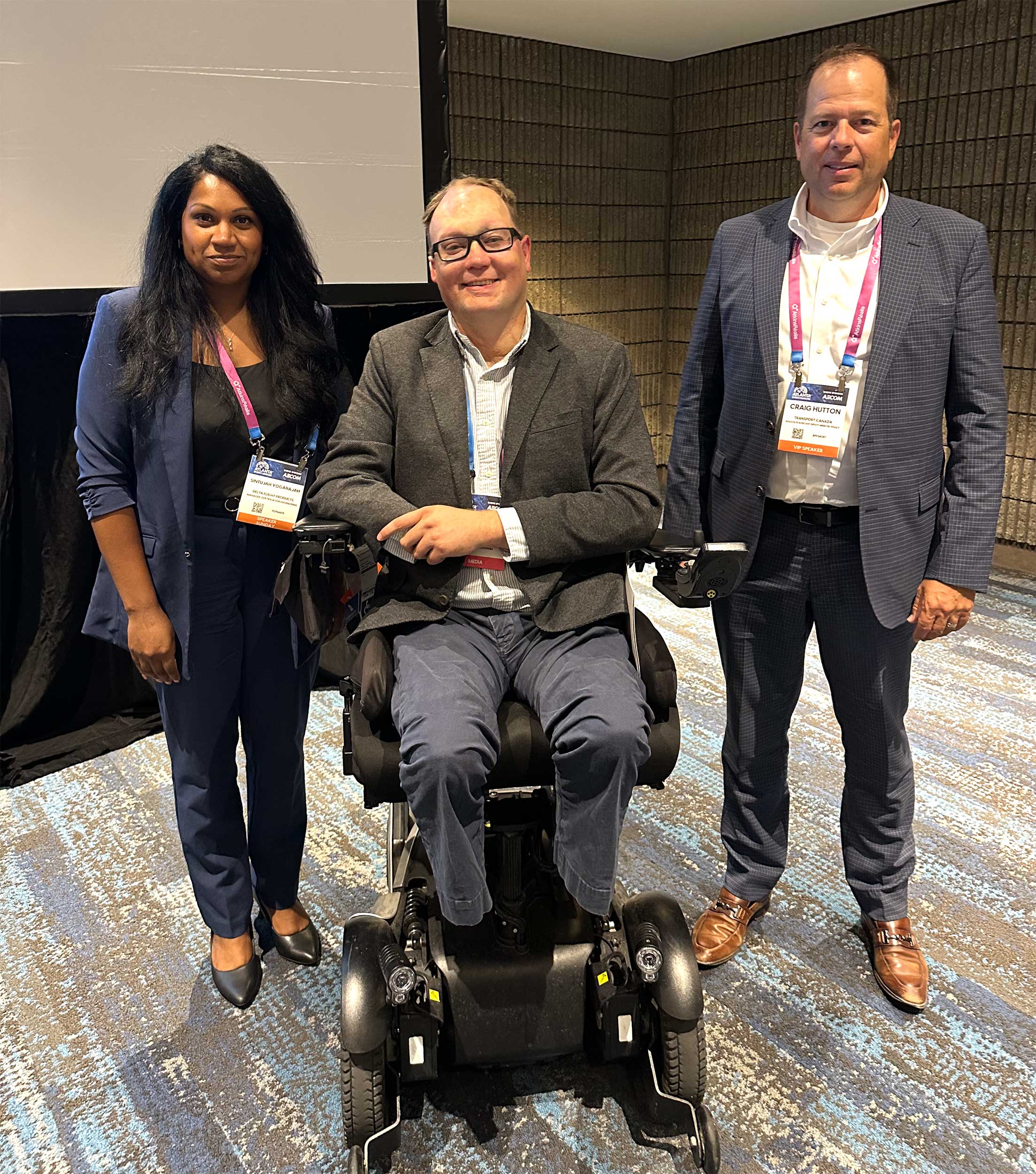 John photographed with the panelists from his discussion.