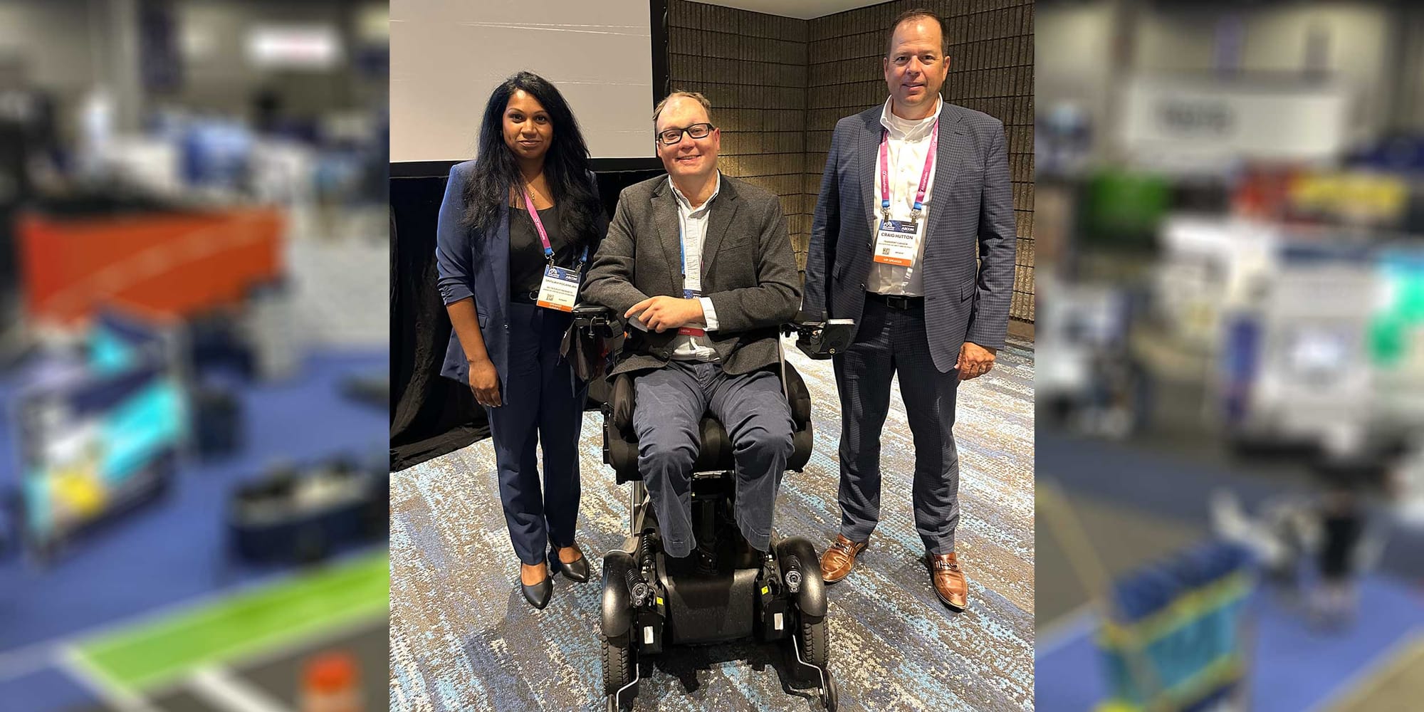 John with his co-panelists at a conference.
