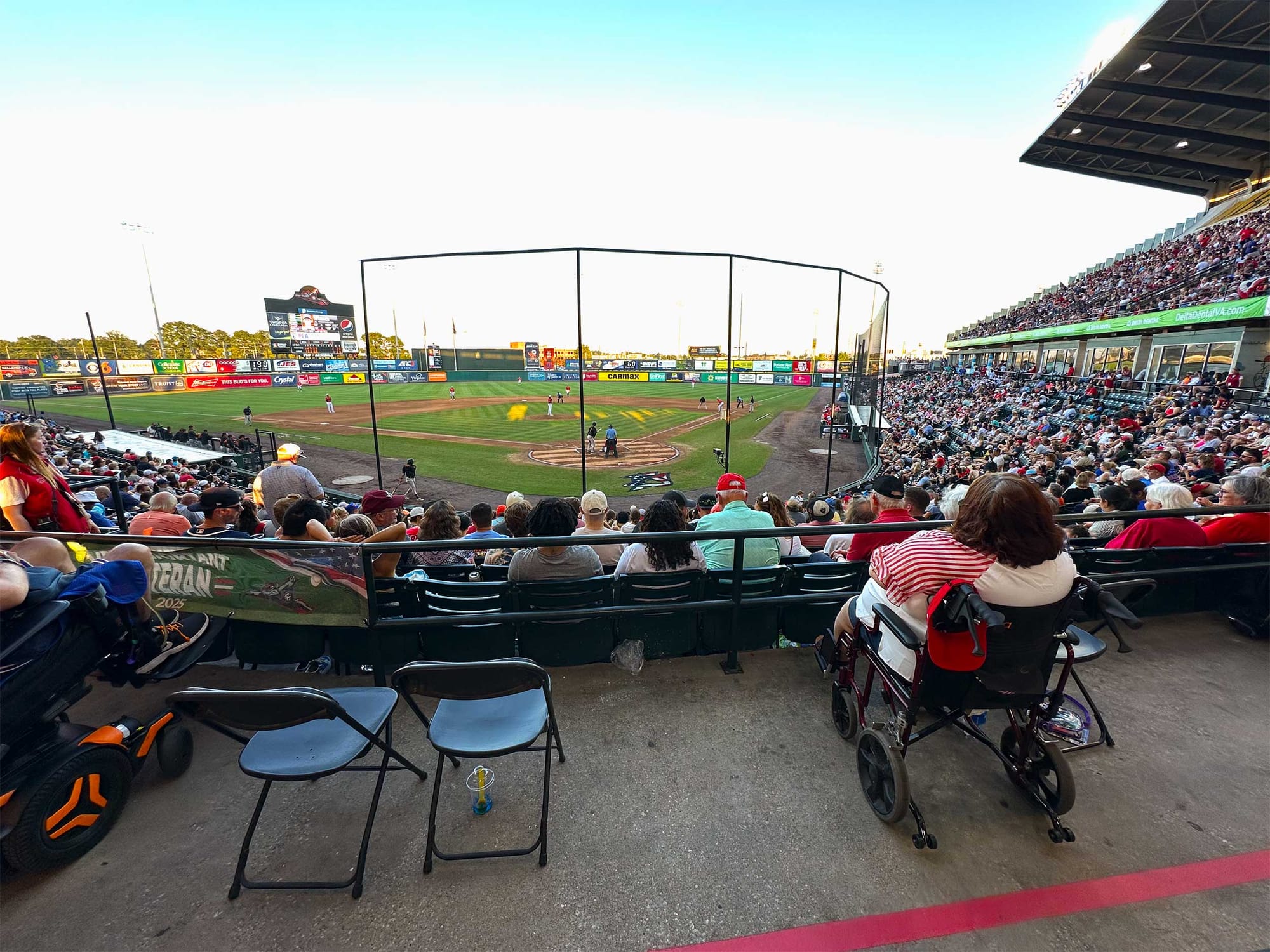 Wheelchair accessible seating behind home plate at ballpark.