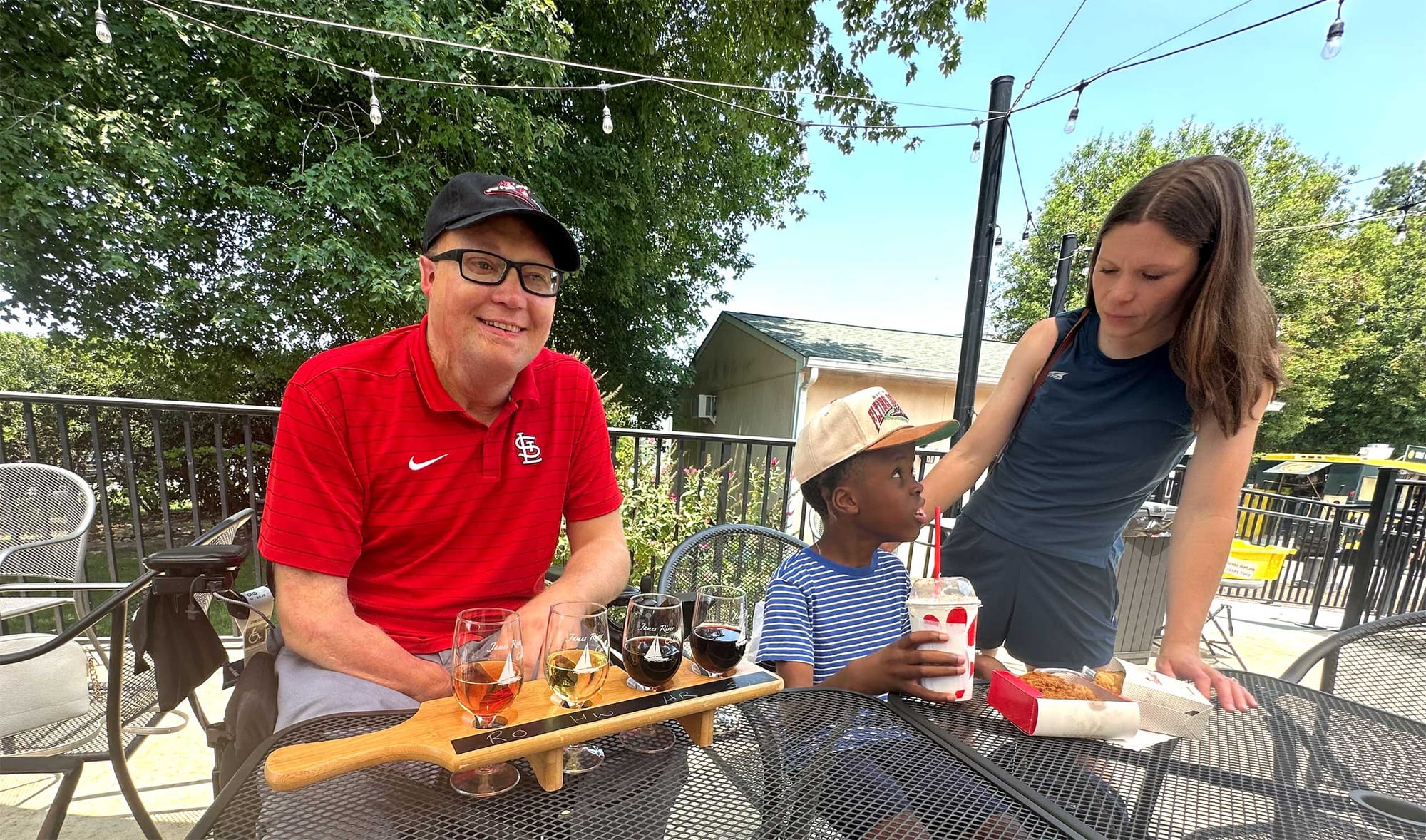 John, Stevie and Robert outside on the patio.