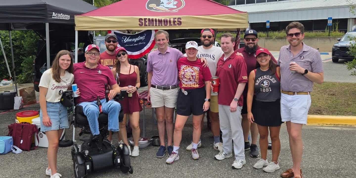 John and Stevie with friends at a college football tailgate.