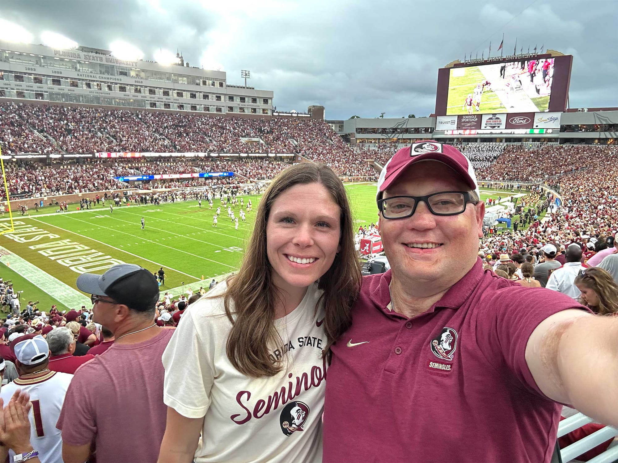 Selfie of John and Stevie inside Florida State college football stadium.