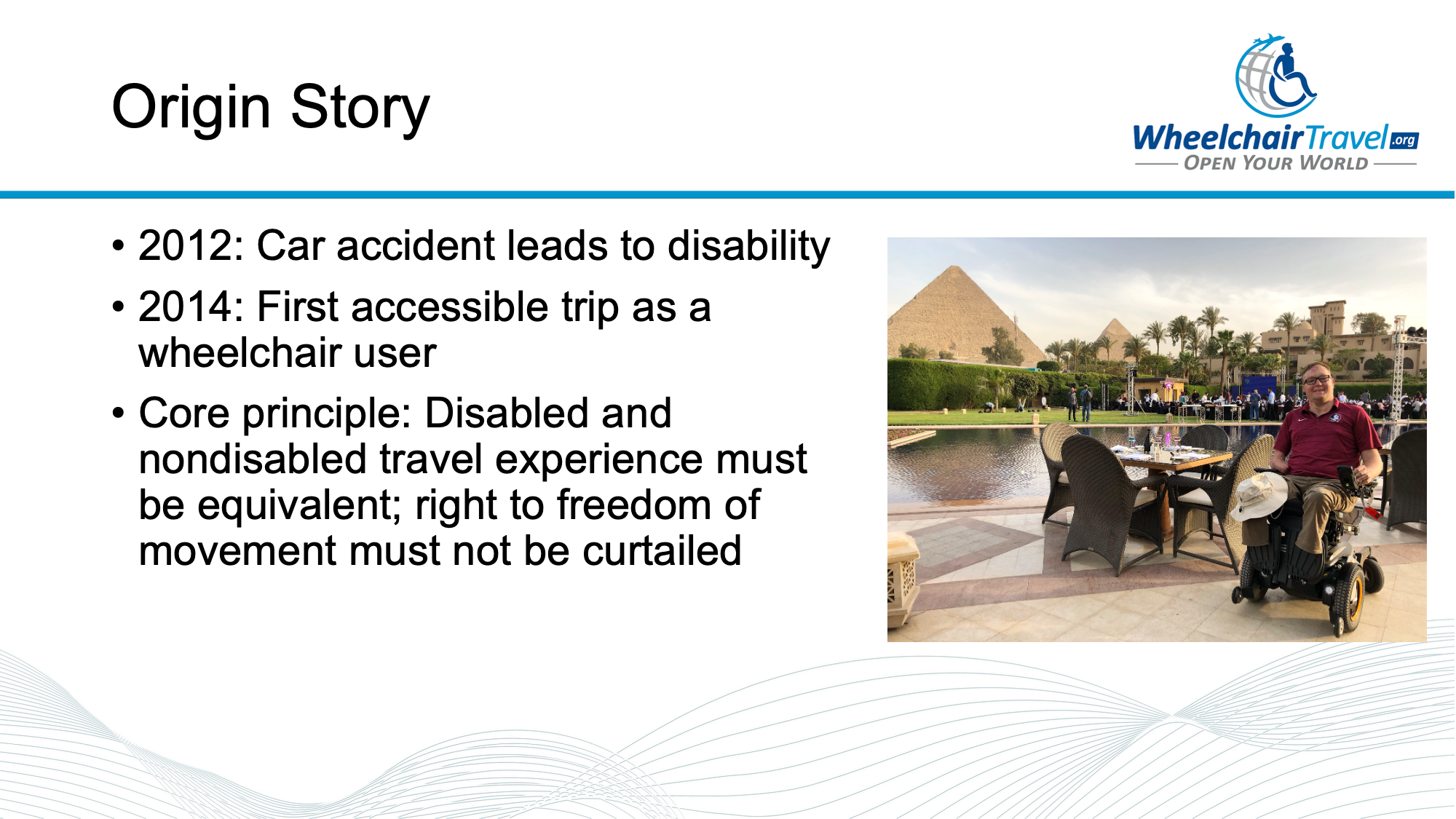 Slide titled origin story, with image of John seated in his wheelchair in front of the Pyramids of Giza.