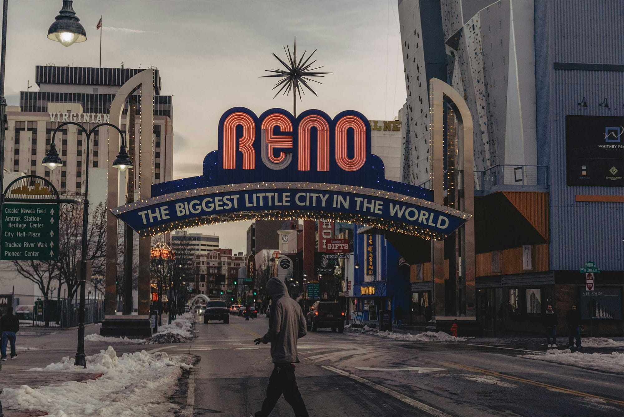 Arched sign over street that reads Reno, The biggest little city in the world.