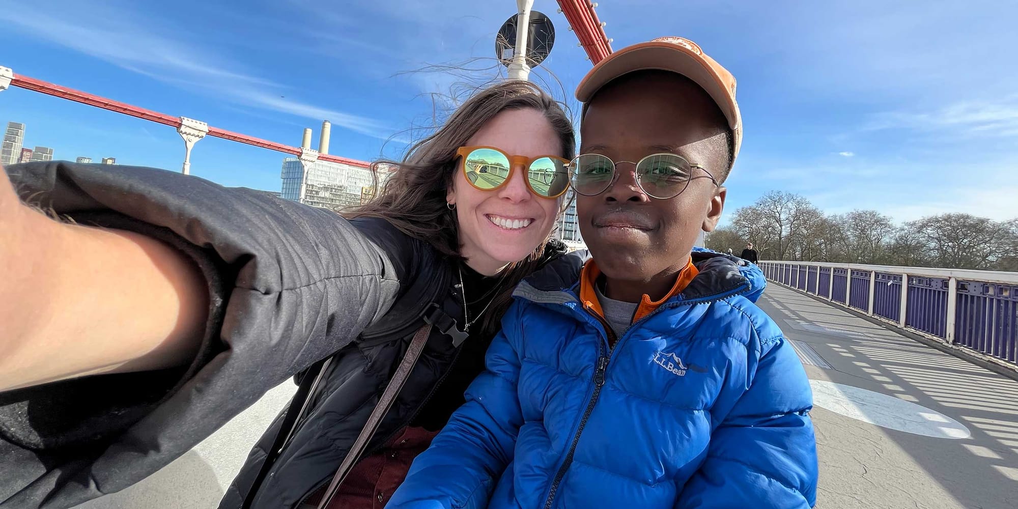 Stevie and Robert taking a selfie on a pedestrian path in London.