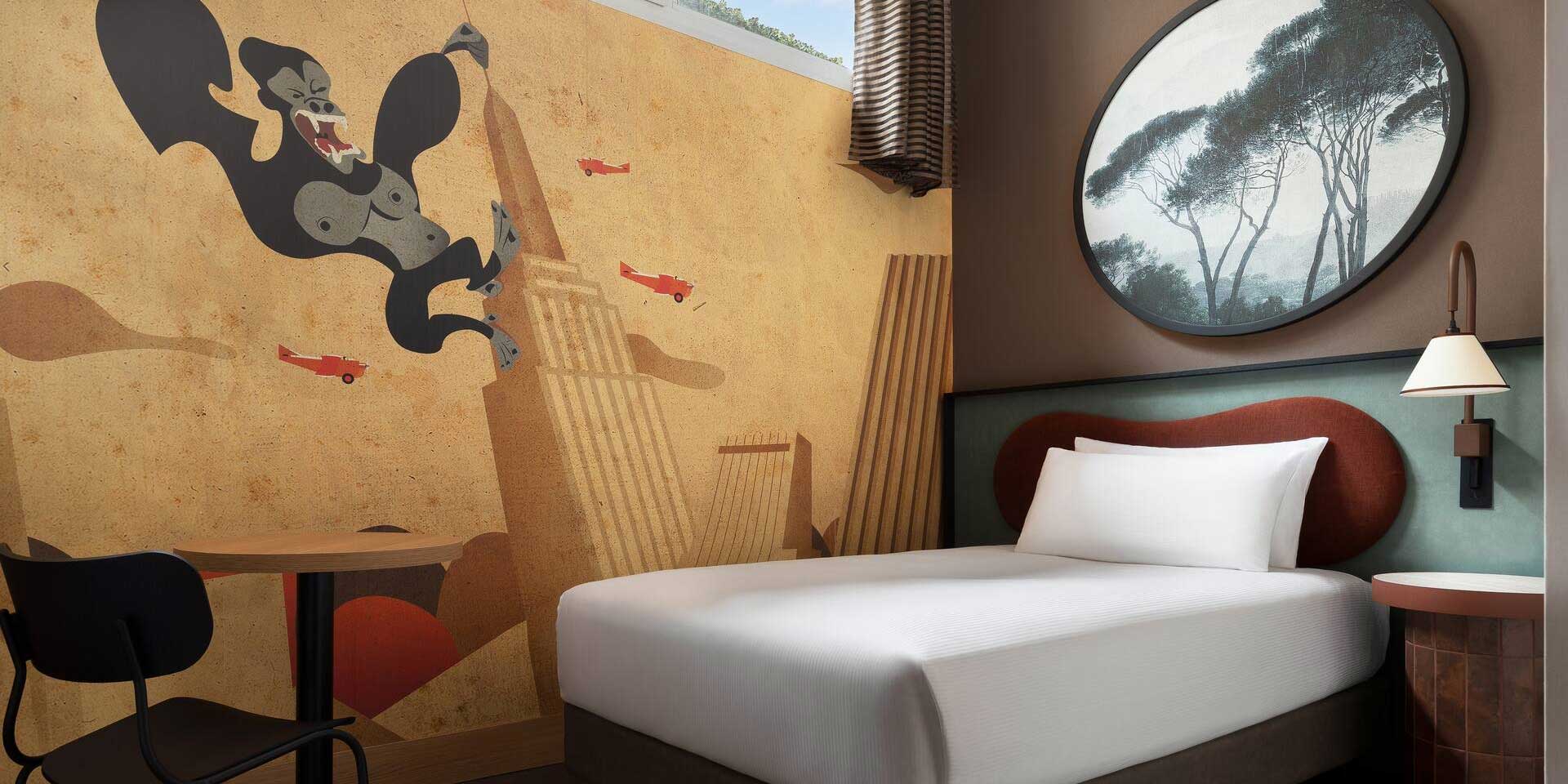 Single bed in wheelchair accessible hotel room.