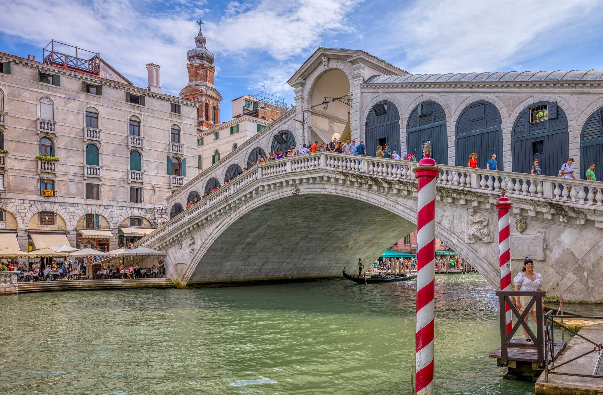 Steep bridge with stairs over canal in Venice.