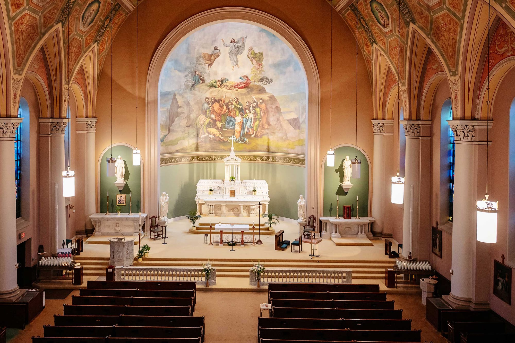 Interior of church with sanctuary and altar, plus recreation of Raphael's painting of The Transfiguration.