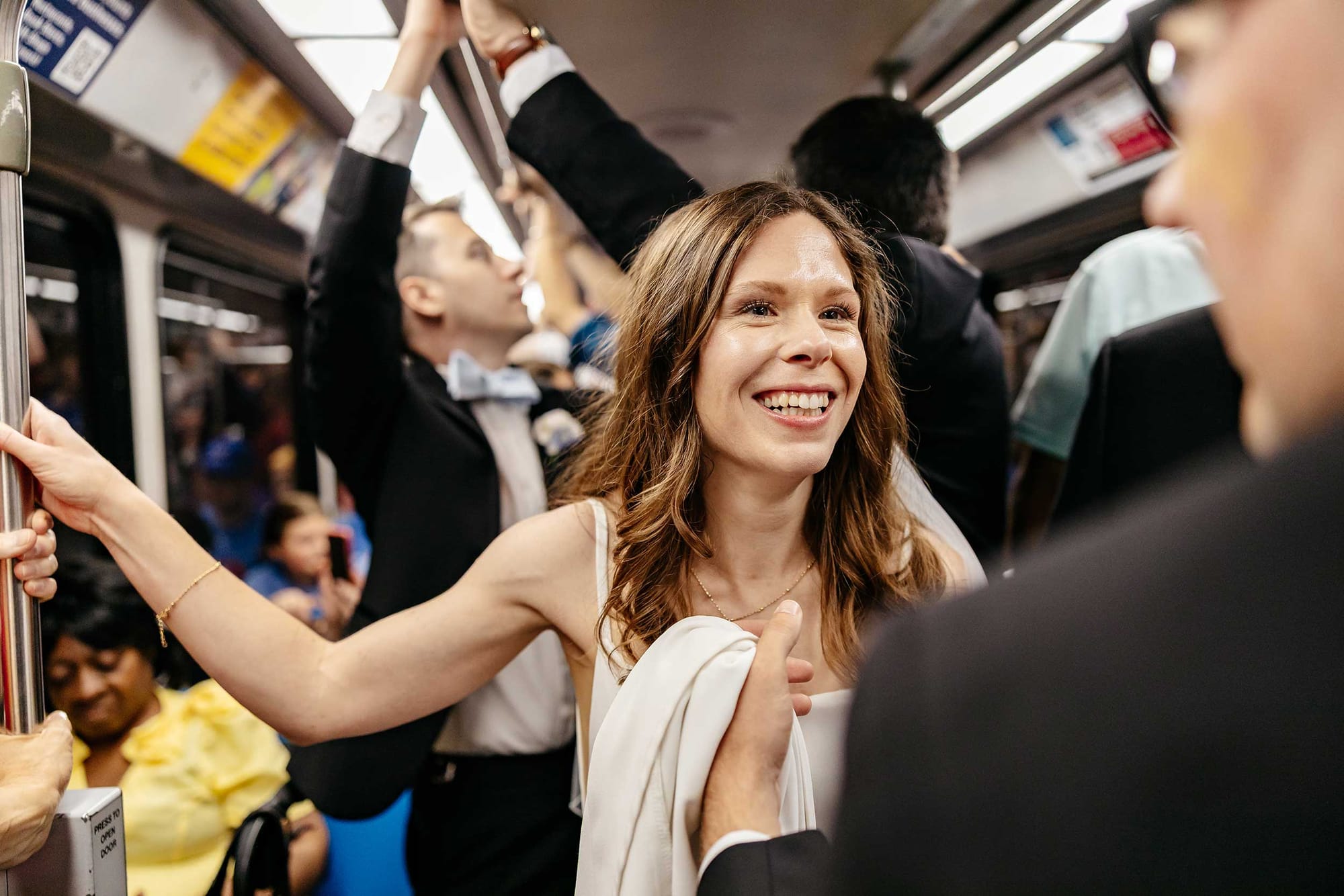 John, Stevie and members of the wedding party on the metro train.