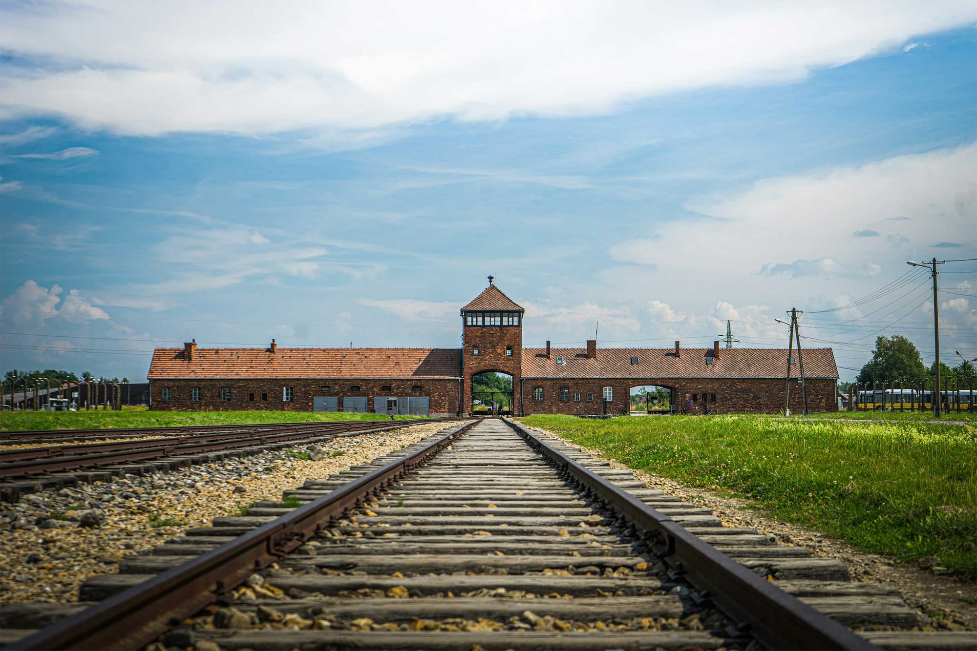 Train tracks leading to entrance of Auschwitz.