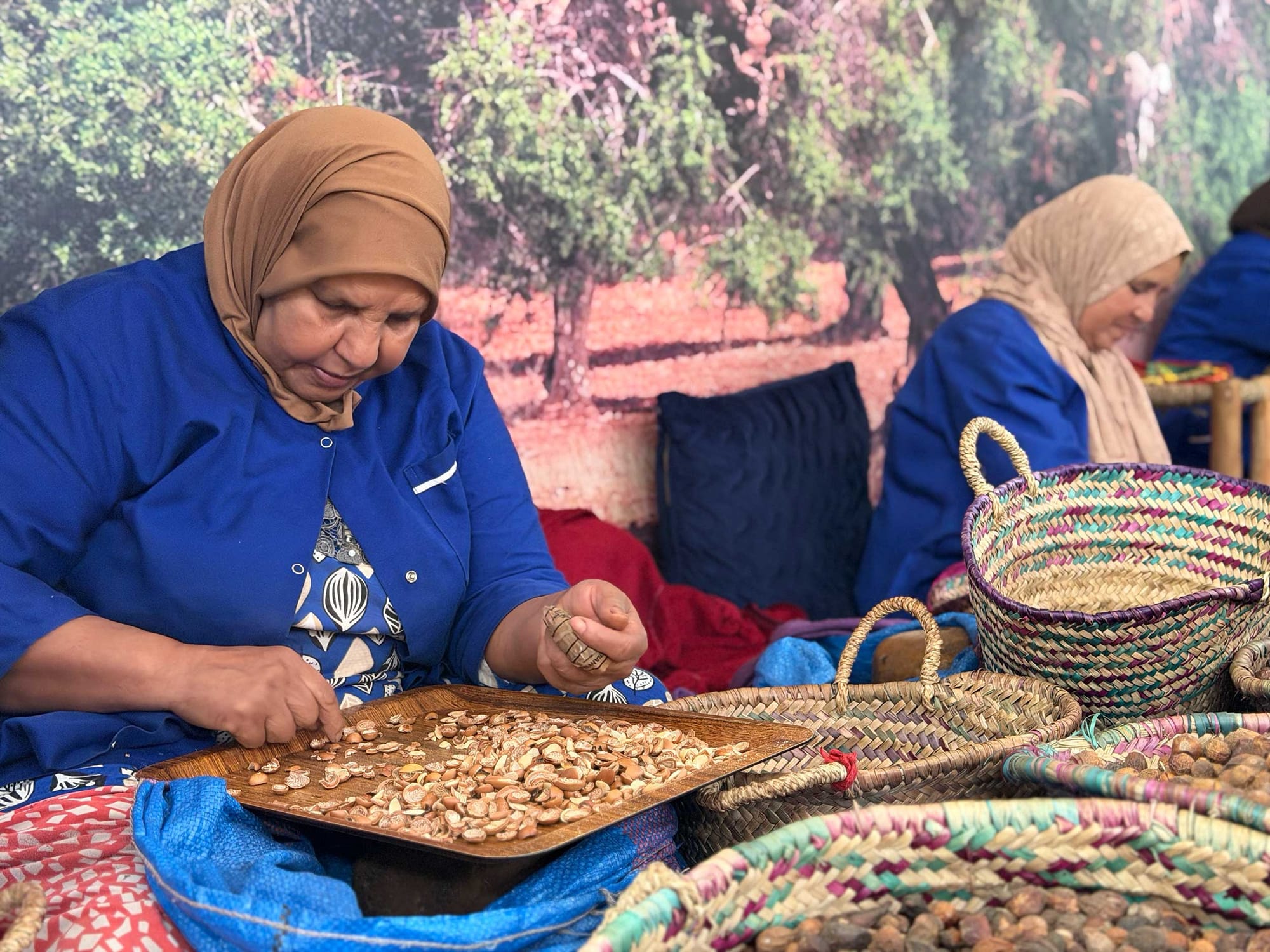 Women sorting argan seeds.