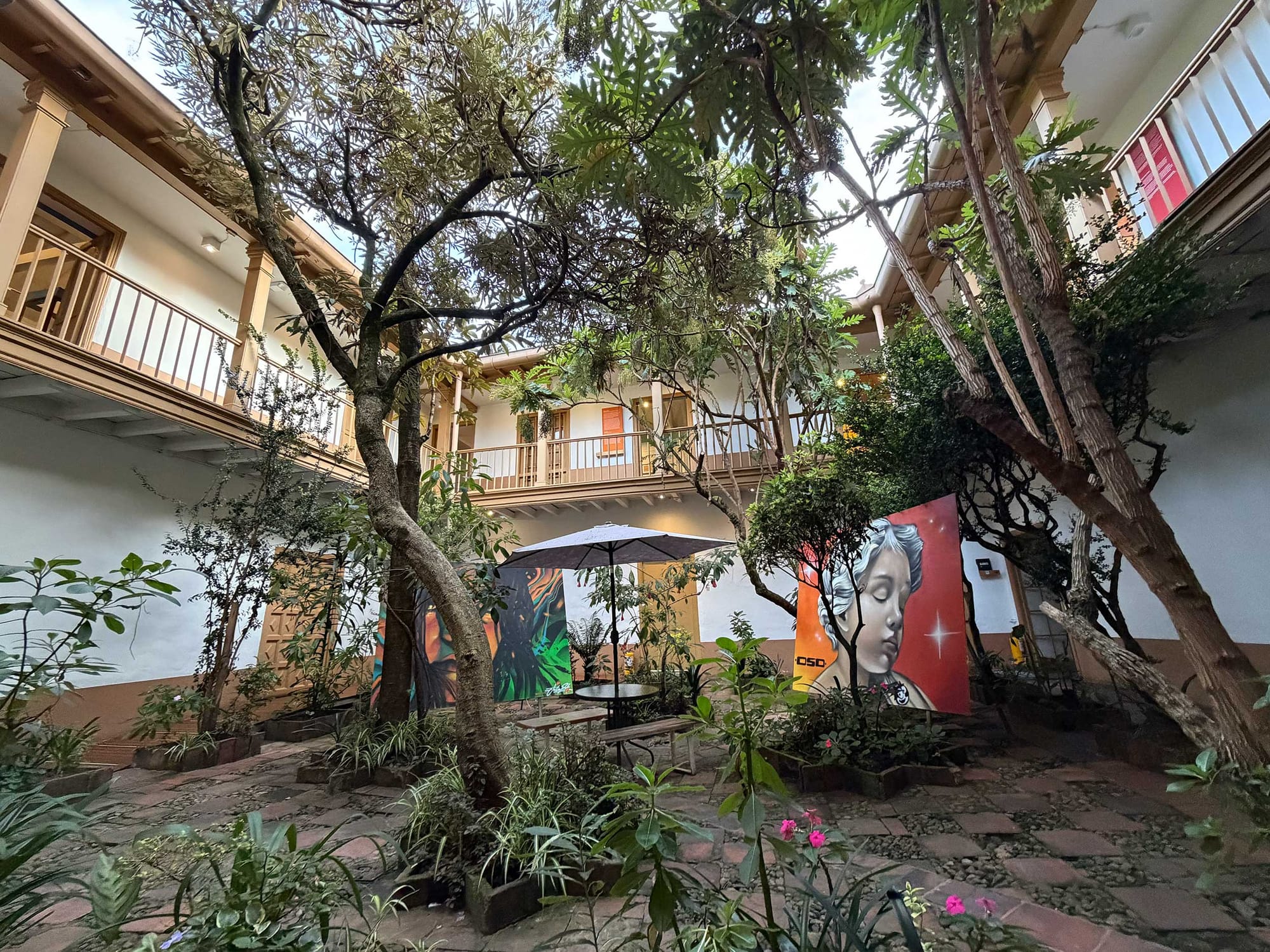 Courtyard inside museum with paintings.