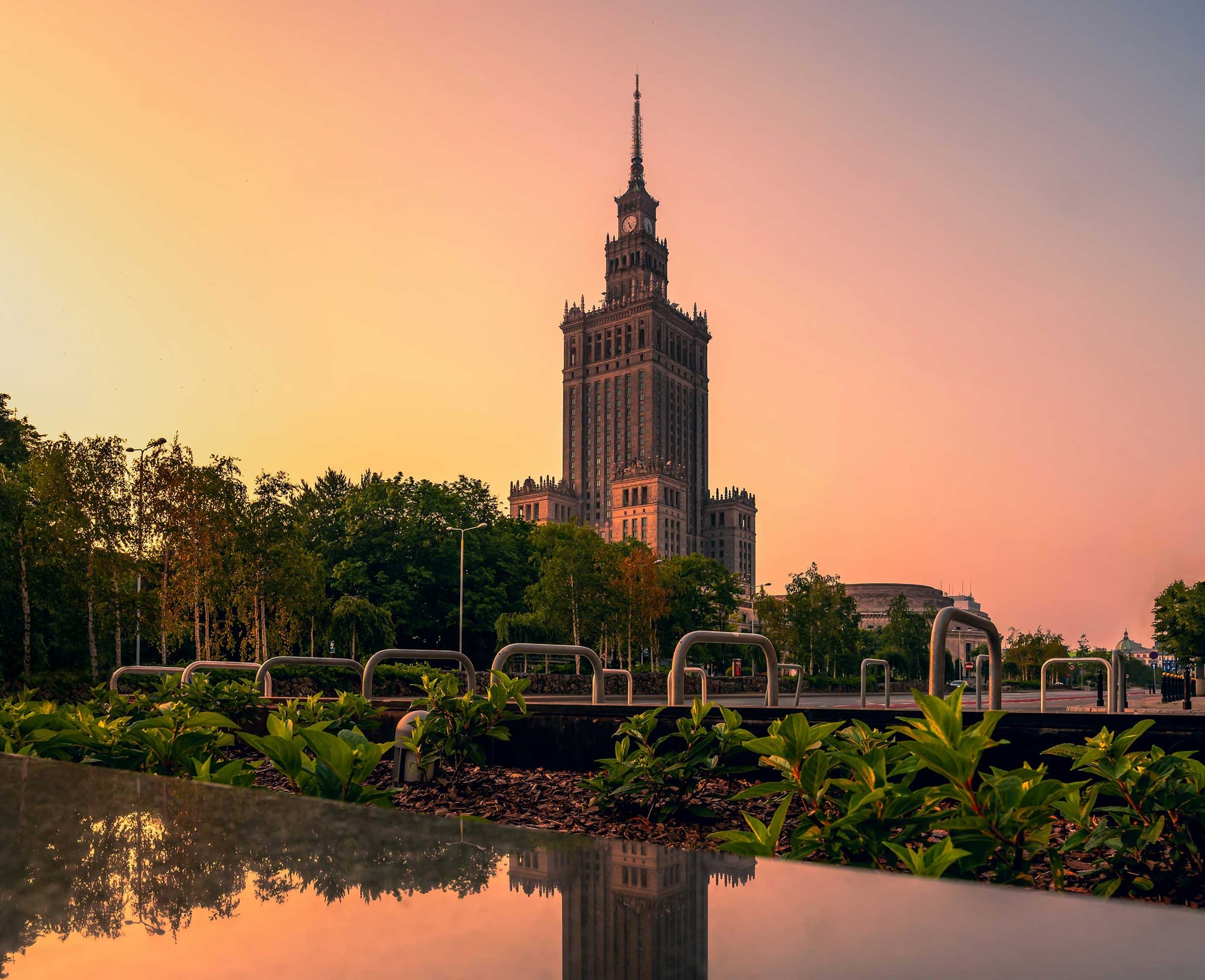 Palace of Culture and Science building seen at dusk from a distance.