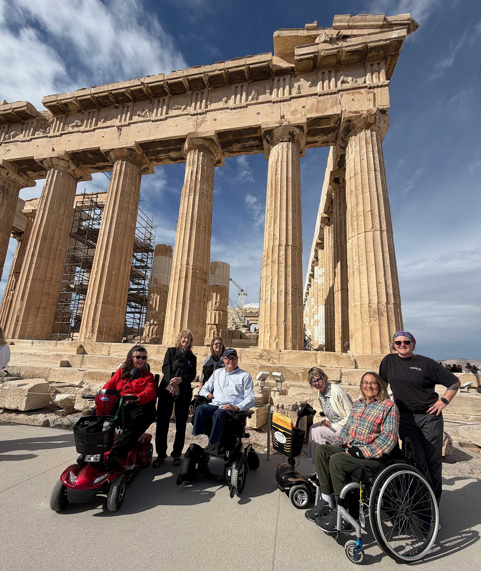Group of wheelchair users in front of the Parthenon on the Athens Acropolis.