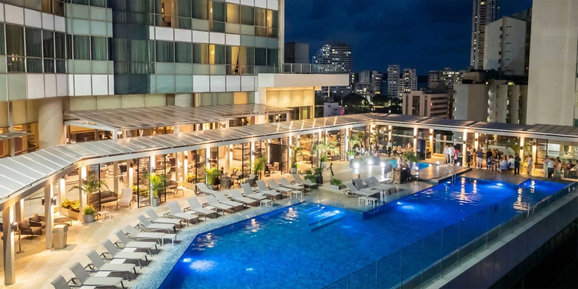 Exterior view of hotel with focus on the swimming pool level.