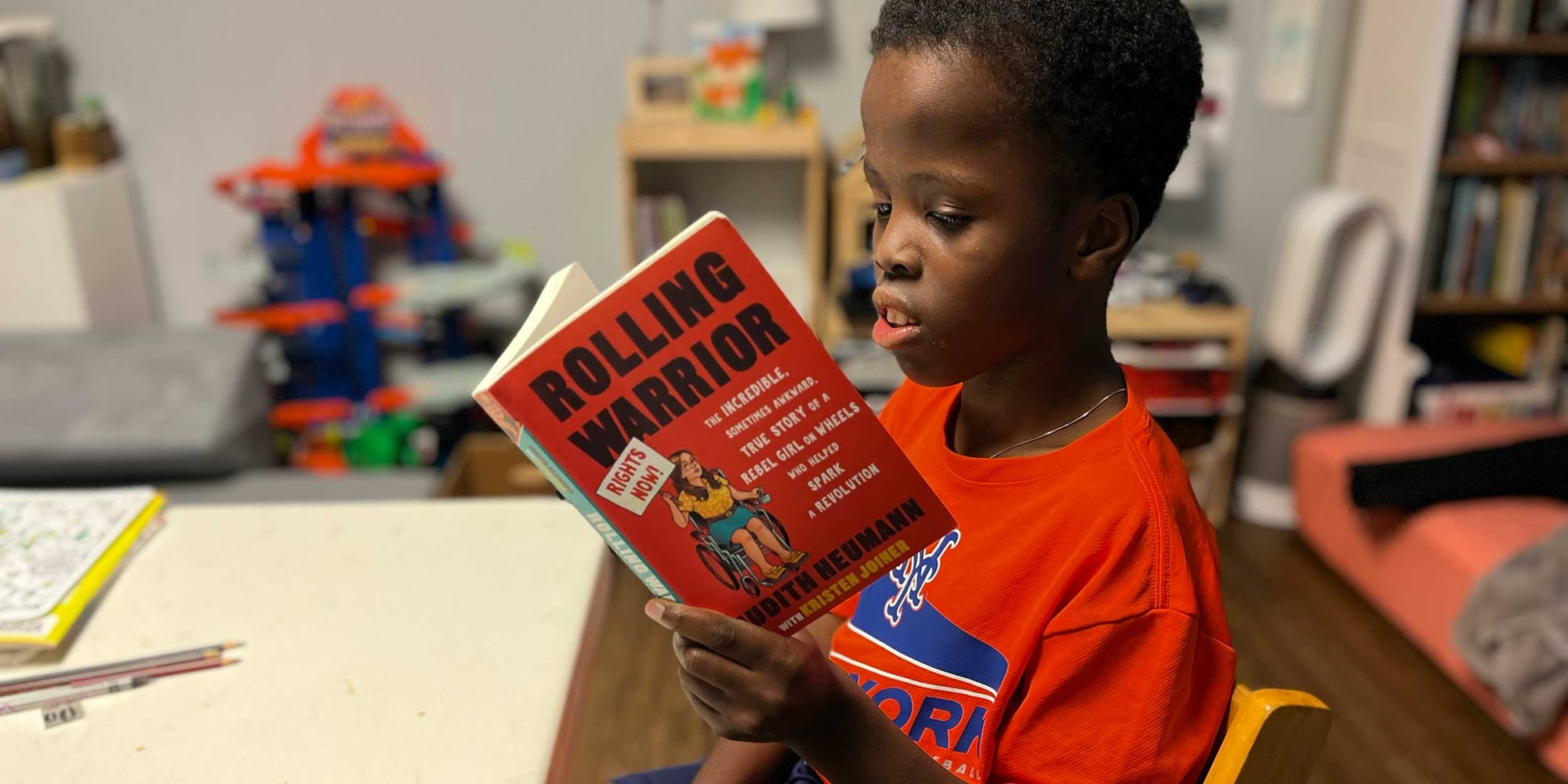 Robert reading the book Rolling Warrior.