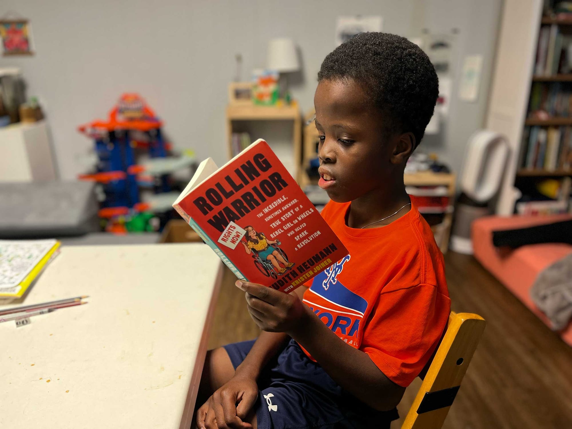 Robert reading the book Rolling Warrior.