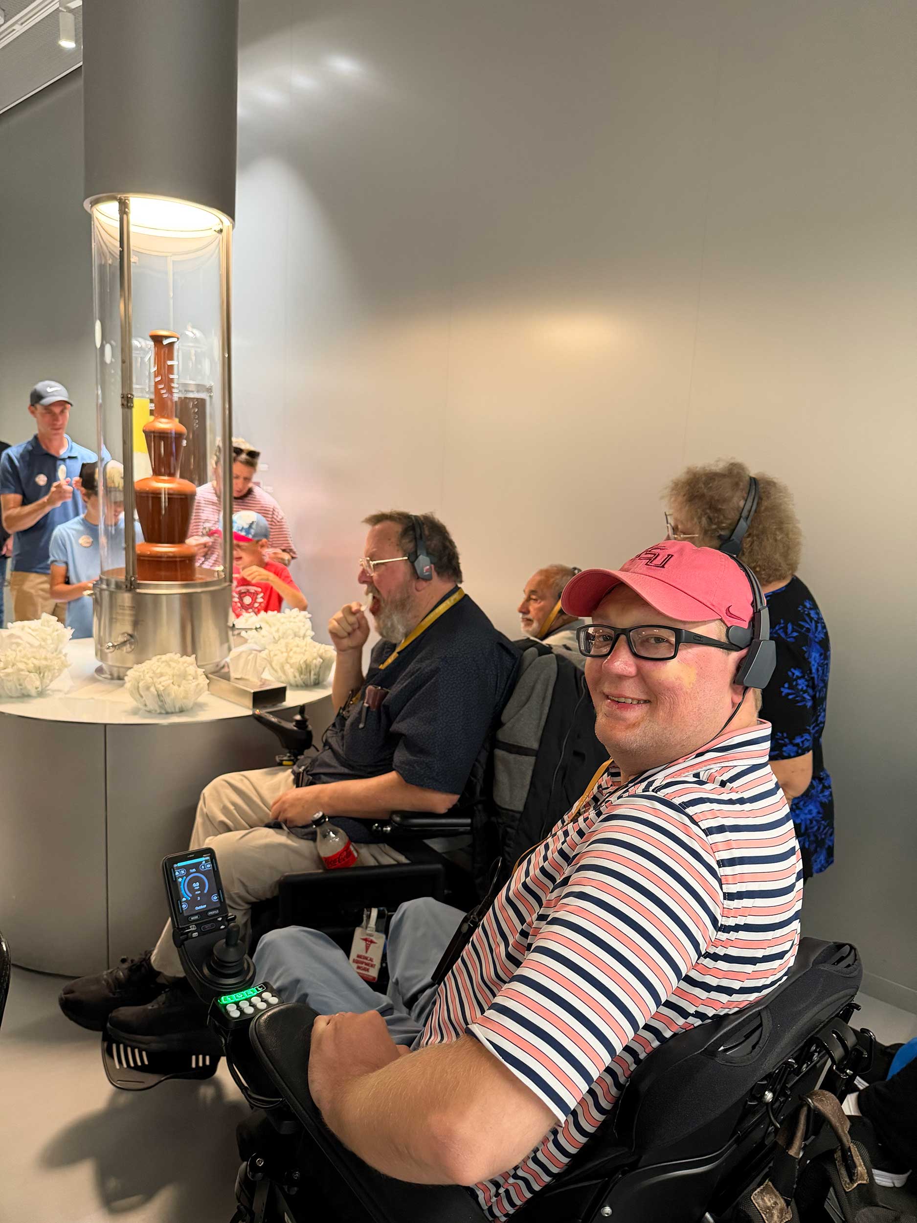 John in front of a chocolate fountain.