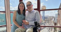John and Stevie pictured with the Knoxville gold ball and skyline in the background.