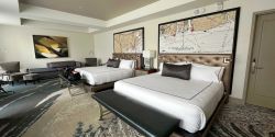 Two large beds in hotel room.
