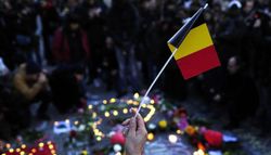 Photo Description: People gathered for a vigil in Brussels, Belgium.