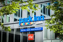 Photo Description: Park Inn by Radisson Brussels Midi, close-up of sign on the outside of the hotel building.