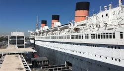 Lengthwise photograph of the exterior of the RMS Queen Mary.
