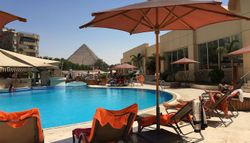 Le Meridien Pyramids Hotel & Spa swimming pool with Egyptian Pyramid in the background