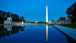 Washington, DC World War II Memorial and Washington Monument at night.